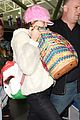 miley cyrus wears ring at airport 12