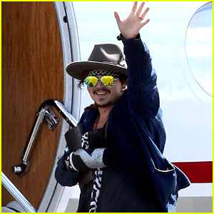 Johnny Depp Leaves Australia with Injured Hand Taped Up